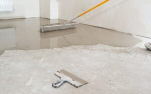 A home renovator levelling their concrete garage floor