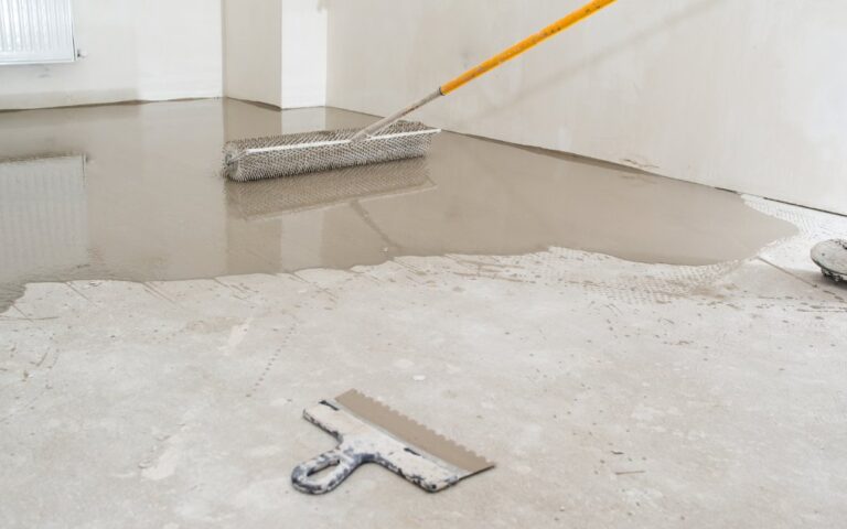 A home renovator levelling their concrete garage floor