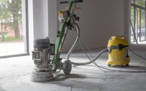 DIY home renovation project with a concrete grinder sitting idle