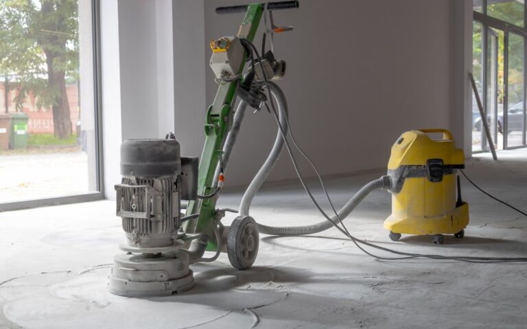 DIY home renovation project with a concrete grinder sitting idle